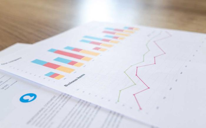 Charts and graphs on paper.