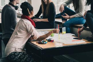 Students studying around a table.